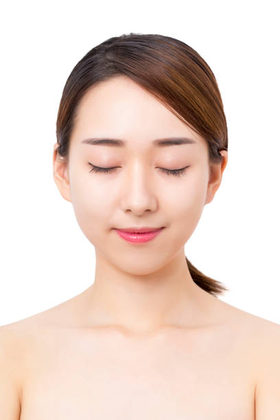 istock Woman face clear skin. 890117898