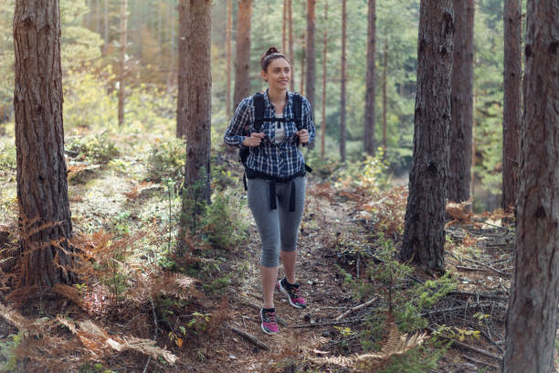 istock Woman going for a walk in the mountains 890121048