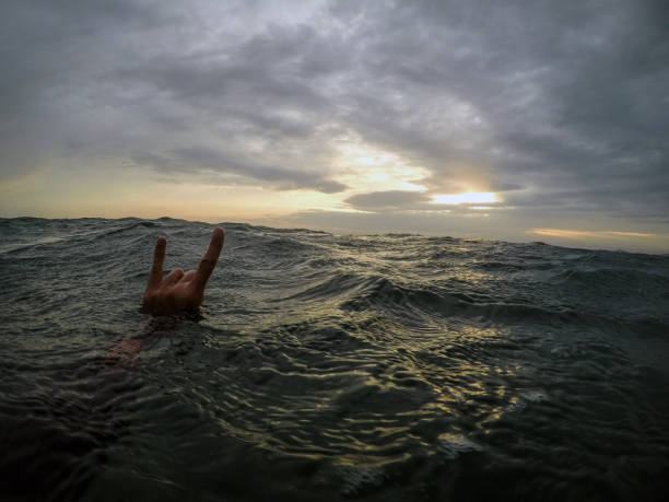 istock Rock on sign in the sea 890123942