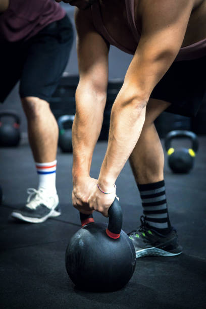 istock Gym fitness - Men Workout Kettlebell 890129706