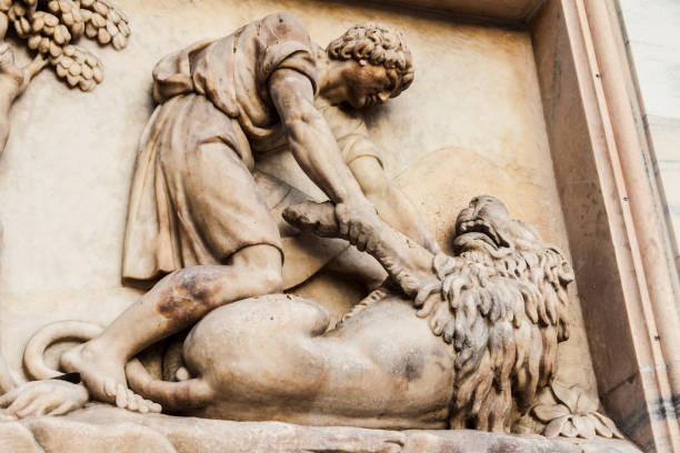 Close-up on the a sculpture of the facade of the Cathedral of Milan (Italy). Sansone Kills the lion. Milan (Italy); 9 september 2012