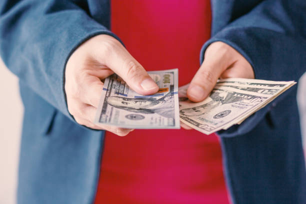 istock American dollars bank note in hand 890136104