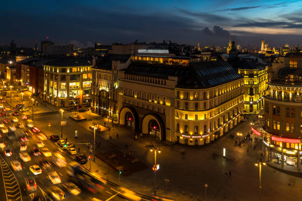 istock urban roofs, horizon line and night traffic 890148362