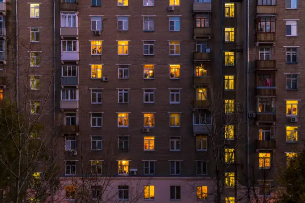 Photo of Illuminated windows of dwelling house