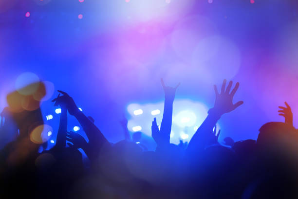 istock People partying at a concert 890154016