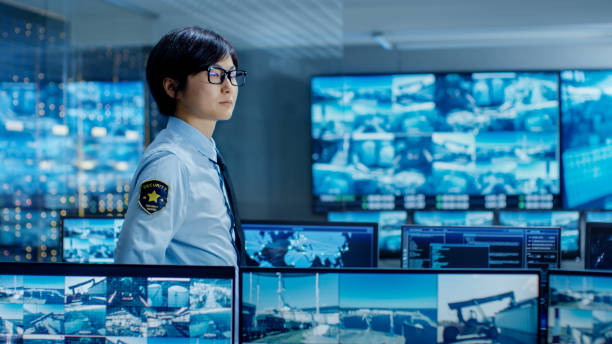 istock In the Security Control Room Officer Monitors Multiple Screens for Suspicious Activities. He Guards Internationally Important Logistics Facility. 890157216