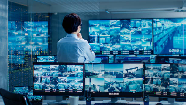 istock In the Security Control Room Officer Monitors Multiple Screens for Suspicious Activities. He Guards Internationally Important Logistics Facility. 890157224