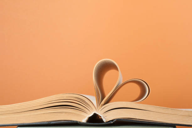 istock Heart from book page.Education background.Copy space for text. 890158244