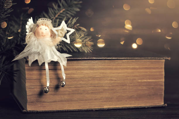 istock Christmas angel holding Christmas star 890160944