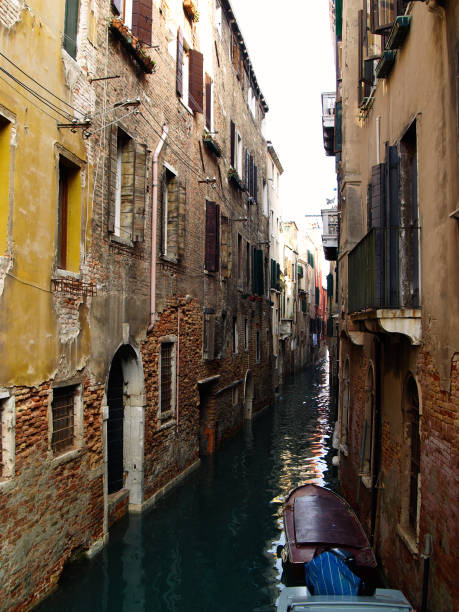 istock Narrow passage in Venice Italy 890160994