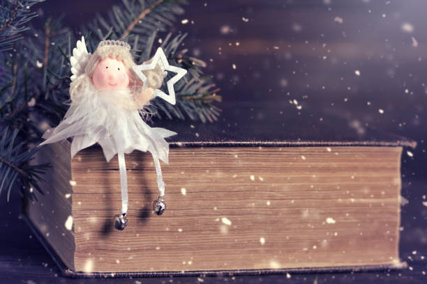 istock Christmas angel holding Christmas star 890161012