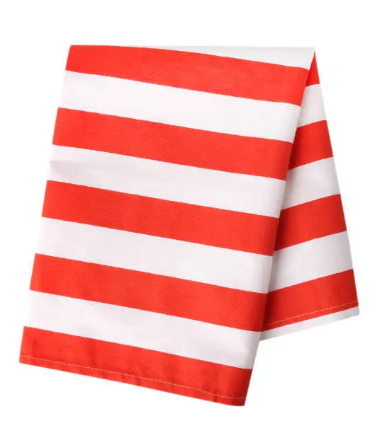 Photo of Red stripped cotton towel isolated.Kitchen cloth.