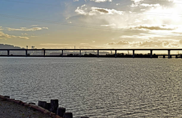 istock Cityscape with bridges and industry on the river 890185962