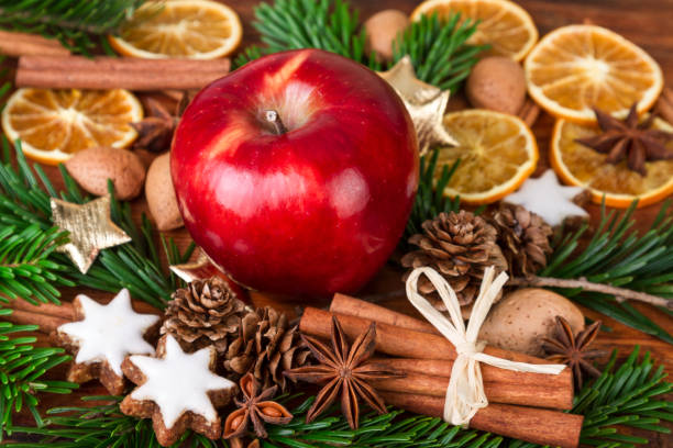 istock Christmas spices with Red Apple decorated over old wooden background 890186548