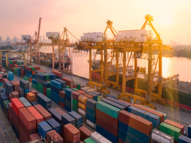 istock container,container ship in import export and business logistic,By crane,Trade Port , Shipping,cargo to harbor.Aerial view,Water transport,International,Shell Marine,transportation,logistic,trade,port 890189716
