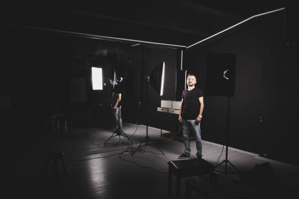 istock Man in the studio with the light equipments 890192750
