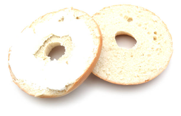 istock Bagel with cream cheese isolated on white background 890196150