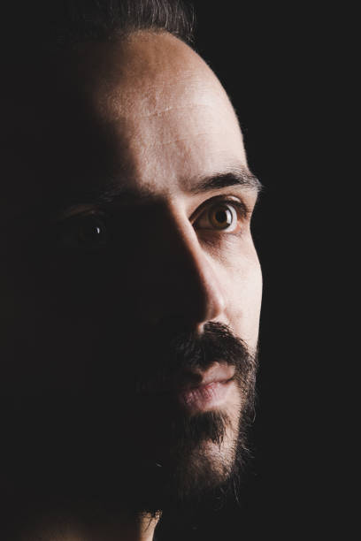 istock Close up portrait serious brunette bearded man 890198570