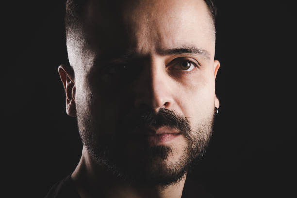 istock Close up portrait serious brunette bearded man 890198730