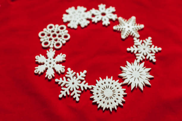 istock Snowflakes on a red background. Christmas toy drive. 890202616