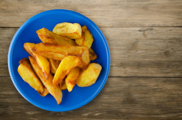 istock fry potatoes on a wooden background 890204954