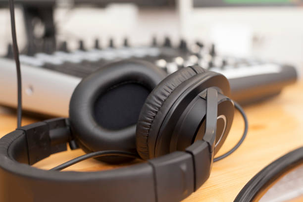 istock Headphones in front of a mixer 890205318