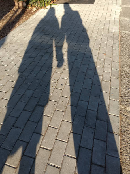 istock Shadow of couple holding hands, love 890205642