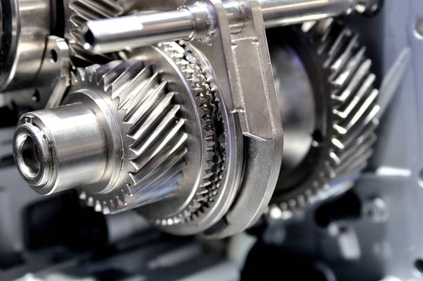 istock Gears on an axle in an opened gearbox. 890205646