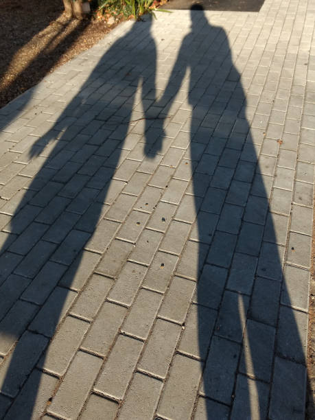 istock Shadow of couple holding hands, love 890205648