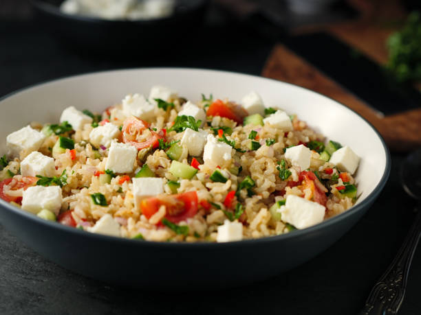 istock Healthy fluffy brown rice and chopped herbs salad 890218574
