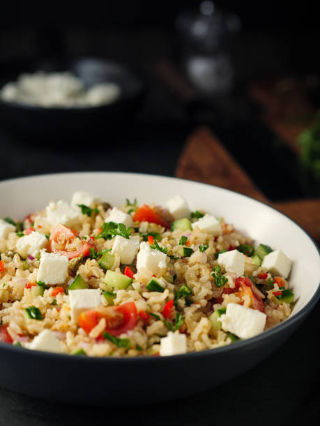 istock Healthy fluffy brown rice and chopped herbs salad 890218576