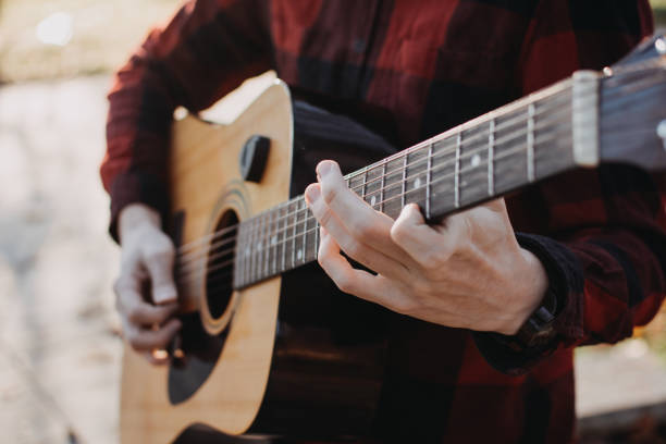 istock Young teenager plays guitar 890221430