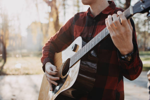 istock Young teenager plays guitar 890221660
