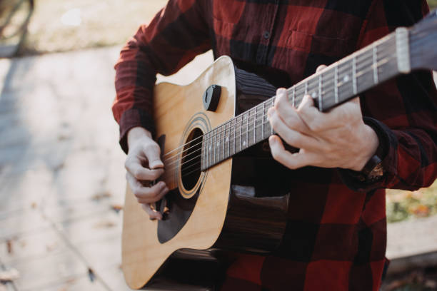 istock Young teenager plays guitar 890221690