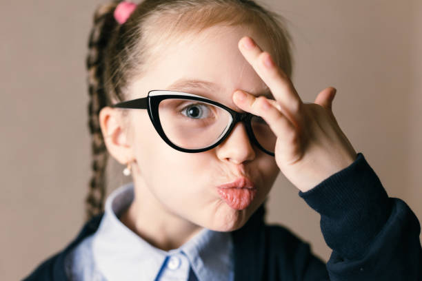 istock Surprised little girl with glasses 890227126