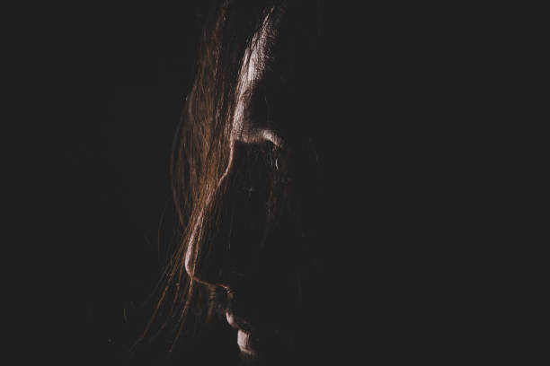 istock Profile of man on dark backround 890233428