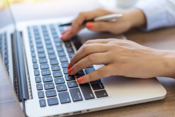 istock Business woman typing on laptop keyboard 890233614
