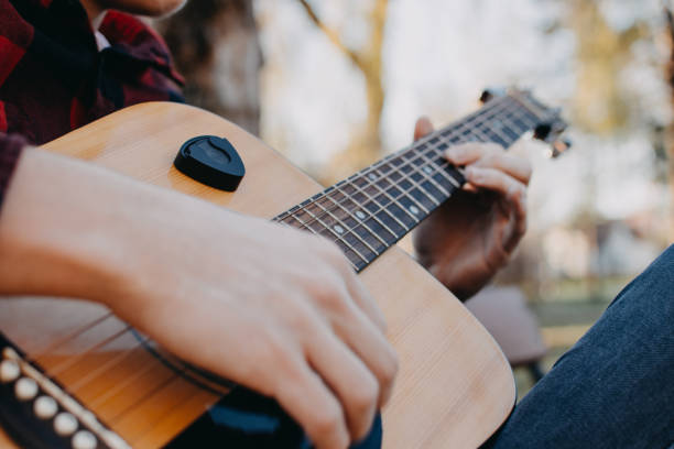 istock Young teenager plays guitar 890233832