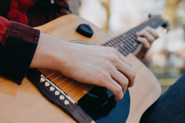 istock Young teenager plays guitar 890238430