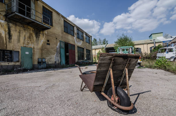 istock abandoned factory with wheelbarrow 890238804