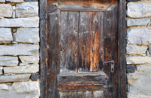 istock old wooden doors in the old stone building for your design 890251922