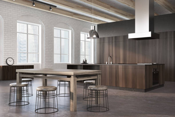 istock Concrete and dark wooden dining room, side 890254756