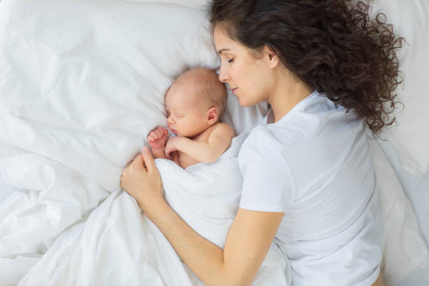 istock The newborn sleeps with the mother. 890255142