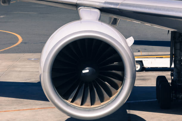 istock Engine of jet passenger plane on the airport apron 890263820