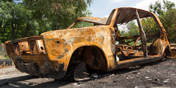 istock An abandoned, stolen burnt out car 890267136