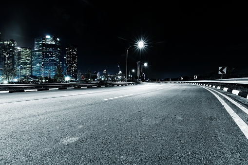 empty asphalt road in midtown of kuala lumpur at night