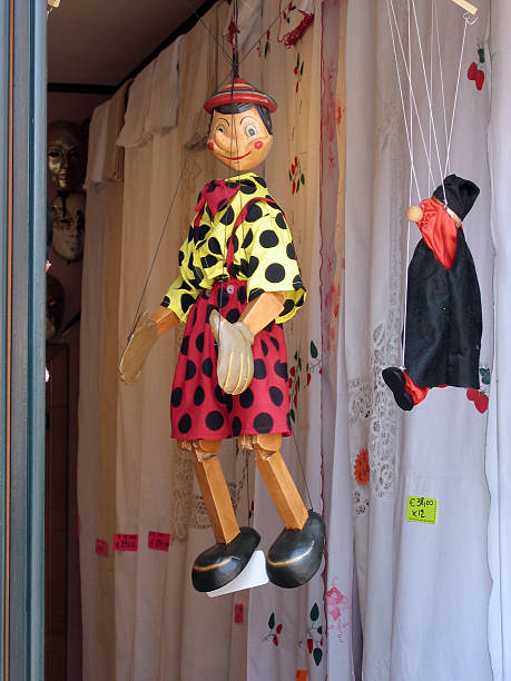istock Pinochio puppet hanging in shop doorway 89028869