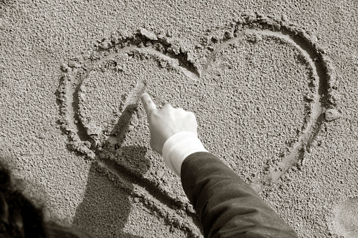 Drawing a hart in a sand