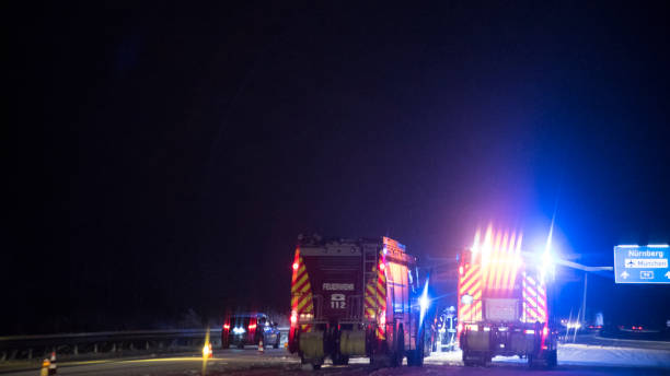 istock Nightshot of firefighter trucks on a German Highway 890305584