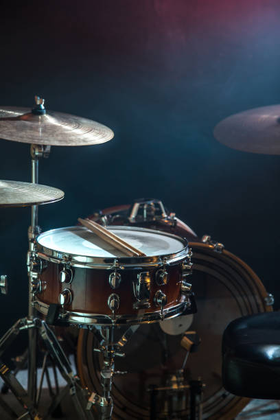 istock musical instruments drum kit, flash of light, a beautiful light in the background with copy space 890305794